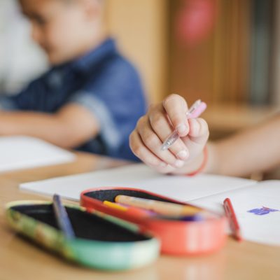 schoolchildren-sitting-desk-with-notebooks